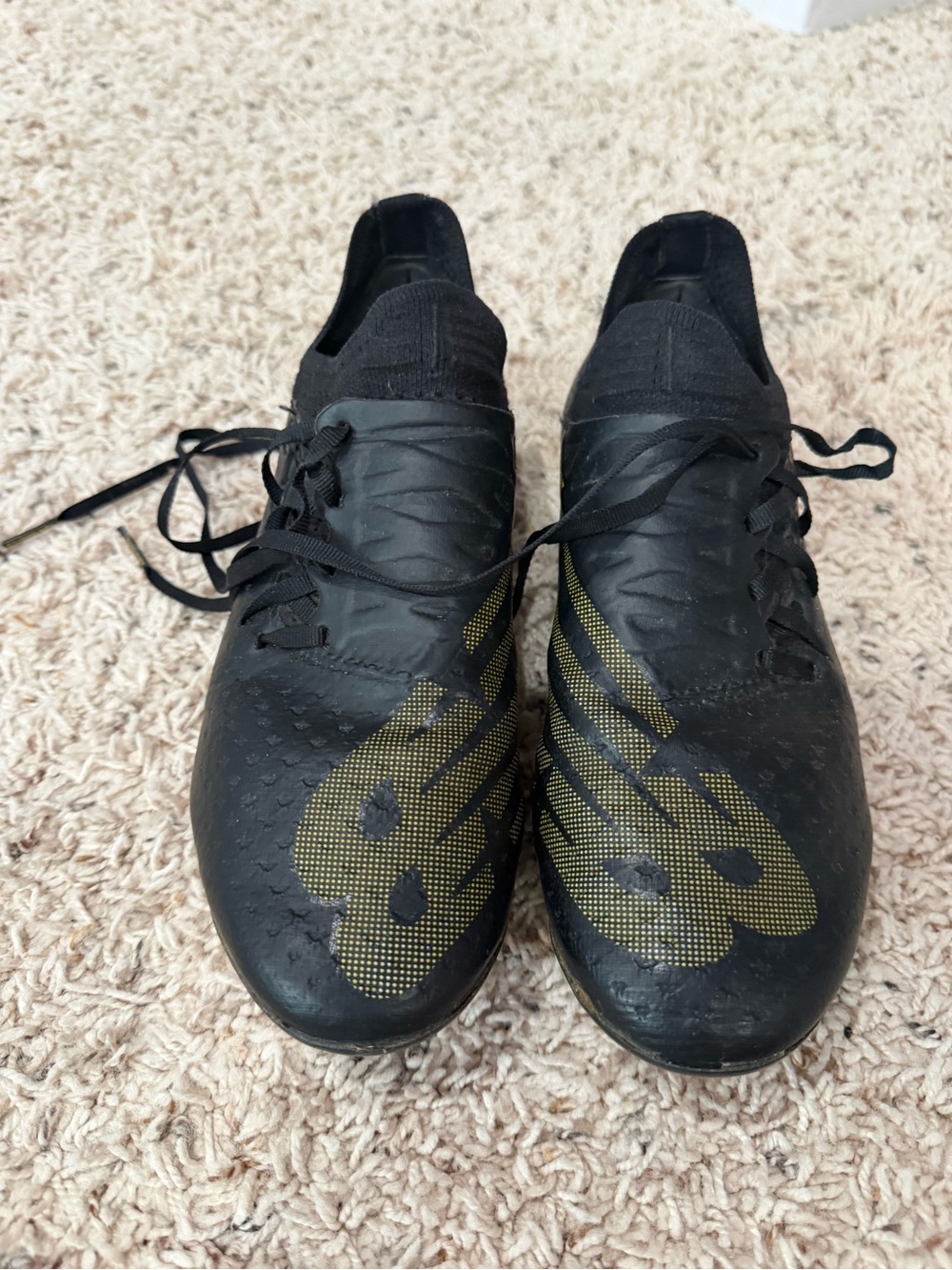 New Balance Men's Black Athletic Shoes with Gold Logo